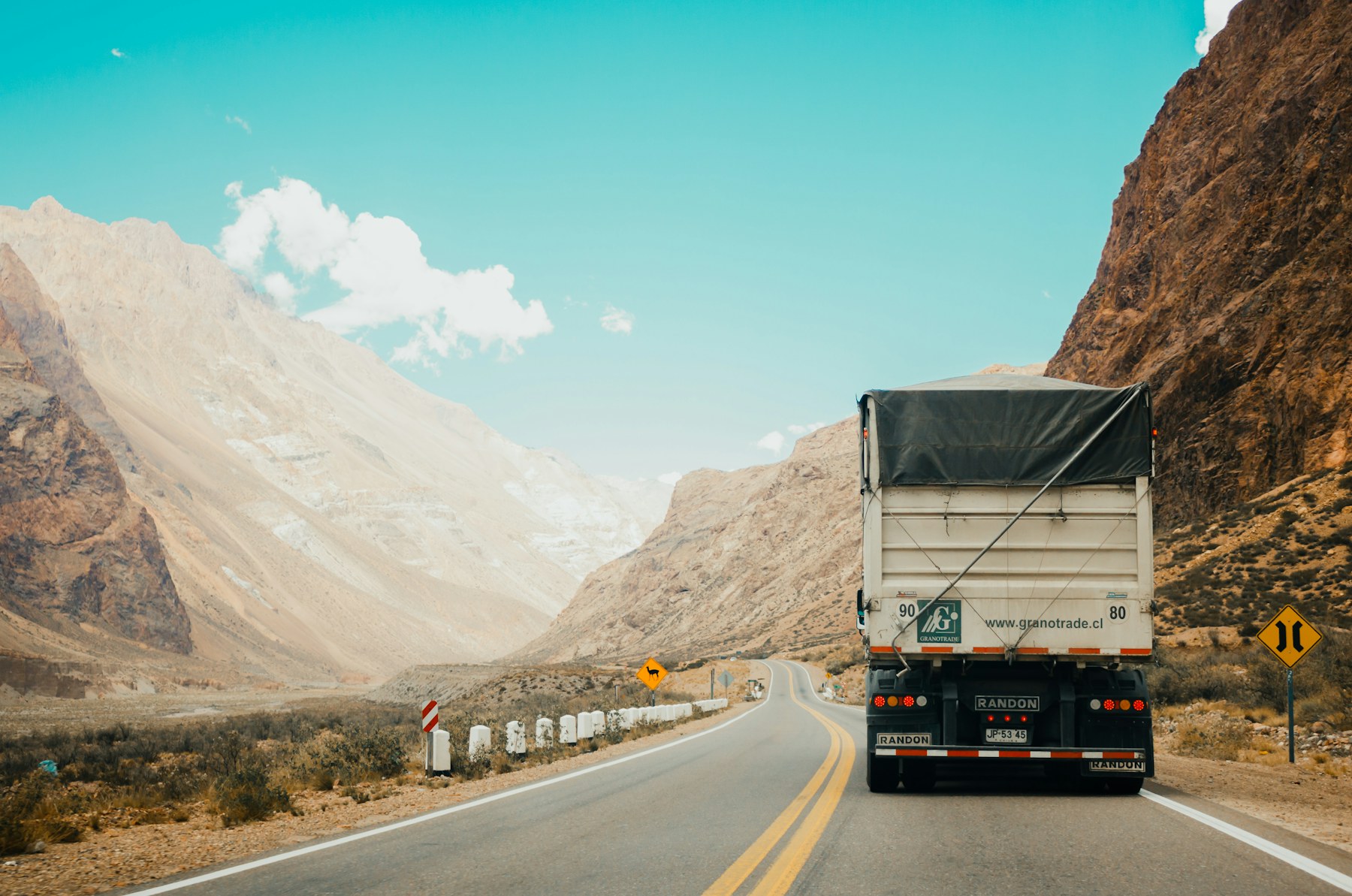Refrigerated truck on an open highway through the mountains